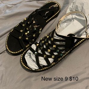 Black sandals with gold stones